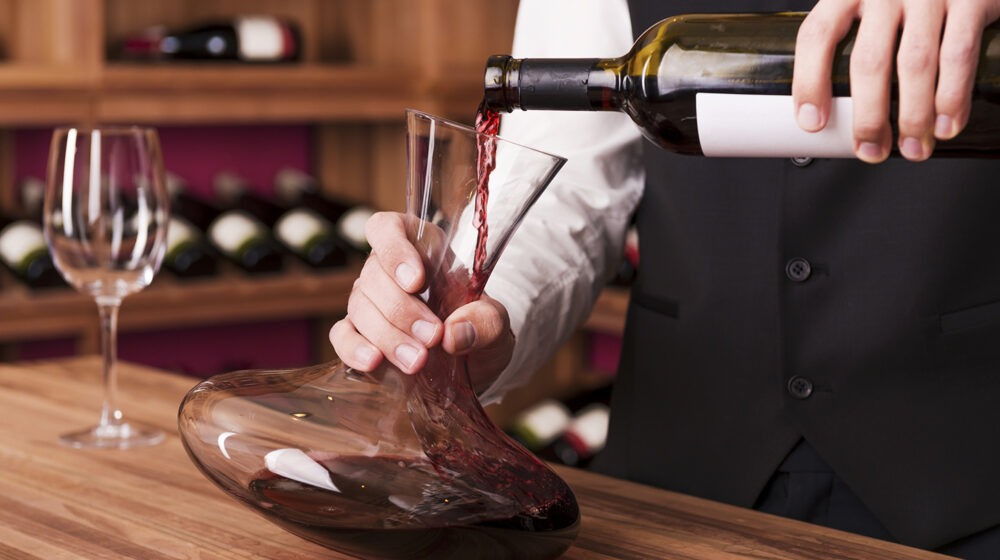 Wine being poured into a decanter