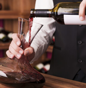 Wine being poured into a decanter