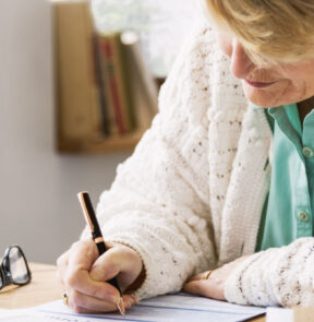 Woman writing on paper