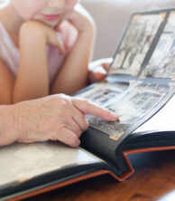 Family looking at scrapbook