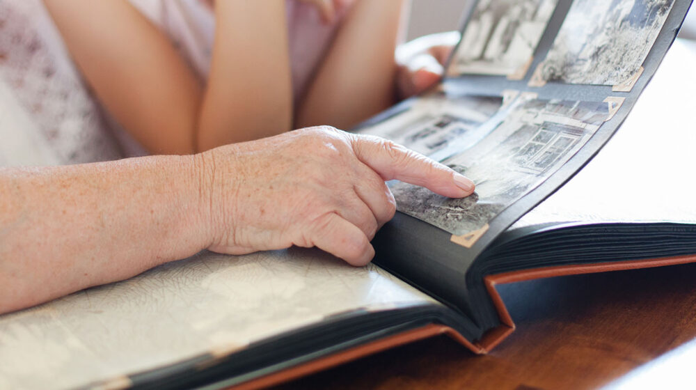 Family looking at scrapbook