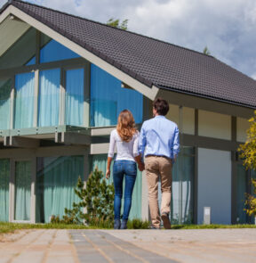 Couple outside of house