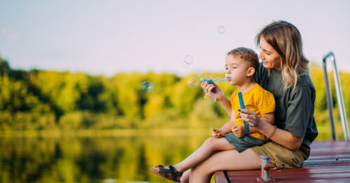 Woman and child near lake